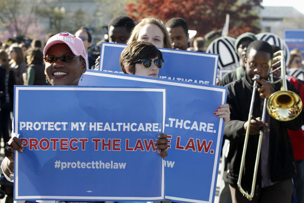 Supporters for the health care reform law signed...