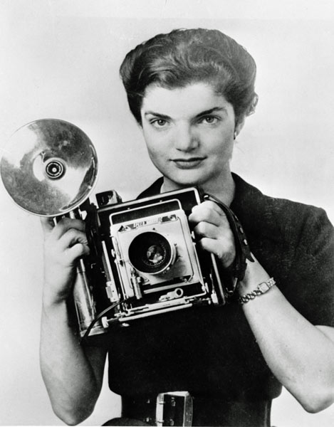 Jacqueline Bouvier Kennedy poses with a Speed Graphic press camera during her stint as an inquiring photographer for the Washington Times Herald in Washington, D.C., in 1953, the same year she married Sen. John F. Kennedy.  (AP Photo)