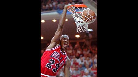 Chicago Bulls forward Michael Jordan screams as he dunks the ball during their 106-101 win over the Orlando Magic in Game Four of the Eastern Conference Finals Monday afternoon May 27, 1996 in Orlando. (AP Photo/Harold Crawford)