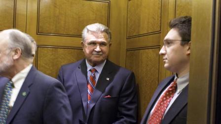 Mike Ditka enters an elevator outside of the Senate Chamber, after speaking to Republicans on Capitol Hill in Washington on Thursday, March 17, 2011.(AP Photo/Harry Hamburg)