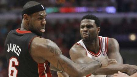 Chicago Bulls center Nazr Mohammed (48) pushes Miami Heat small forward LeBron James (6) to the floor during the first half of Game 3 of an NBA basketball playoffs Eastern Conference semifinal on Friday, May 10, 2013, in Chicago.