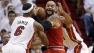 Chicago Bulls Carlos Boozer, center, works the ball between Miami Heats LeBron James (6) and Shane Battier, right, as he attempts to shoot during the first half of Game 5 of an NBA basketball Eastern Conference semifinal in Miami.
