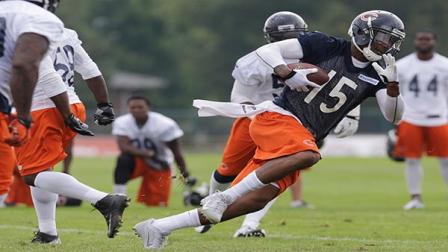 Chicago Bears wide receiver Brandon Marshall (15) runs with a ball during NFL football training camp Saturday, July 27, 2013, at Olivet Nazarene University in Bourbonnais, Ill. (AP Photo/Nam Y. Huh)