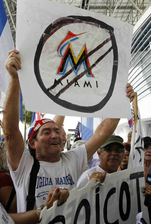 Miami Marlins president David Samson, left,...