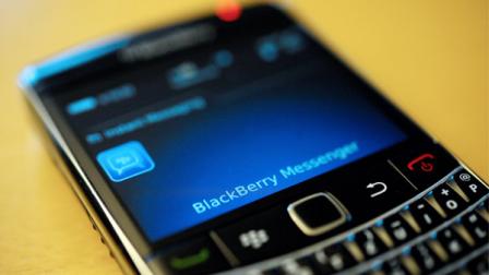 FILE - This file photo taken Sept. 8, 2011, shows a BlackBerry smartphone using the Messenger service, in Berlin. BlackBerry users were hit with service disruptions to their smartphones for a second day on Tuesday Oct. 11, 2011 after an unexplained glitch cut off Internet and messaging services for large numbers of users across Europe, the Middle East and Africa.