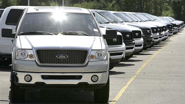 F-150 pickup trucks are shown on a dealership lot. (AP)