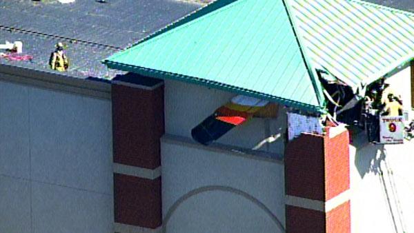 A small plane crashed into the roof of XSport fitness, located at 2780 Fitness Dr. in Naperville, Ill., on Wednesday.