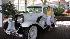 Roz Varon stands next to a 1929 Cadillac.