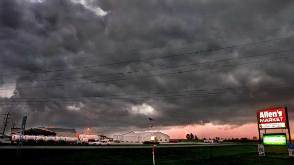 Lighting strikes while thunder clouds form over Ashland, Ill., Wednesday, July, 19, 2006. (AP Photo/Seth Perlman)