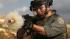 An Israeli border policeman fires tear gas at...