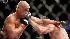Forrest Griffin, right, punches Tito Ortiz...