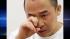 Koua Fong Lee wipes his eye as he is interviewed...