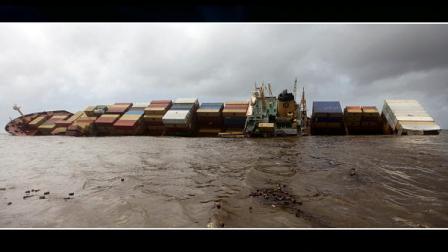 The Panamanian-registered container ship MSC Chitra that had Saturday collided with the MV-Khalijia-II, a St. Kitts registered ship, tilts in the Arabian Sea, close to Mumbai, India, Monday, Aug. 9, 2010. Indian coast guard ships and helicopters are working to try and contain an oil spill from the dangerously tilting container ship following the collision near Mumbai, a spokesman for Indias defense ministry said Monday.