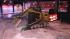A bobcat snow plow clears the sidewalk at the...
