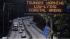 A tsunami warning is flashed along Highway 17 in...