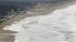 The surf comes ashore during a tsunami warning...