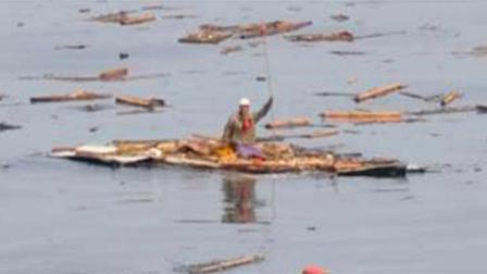 In this photo released by the Japanese Defense Agency, Hiromitsu Shinkawa waves to rescuers before being rescued to a Maritime Self-Defense Force destroyer on Sunday March 13, 2011. When spotted, the 60-year-old man was floating off the coast of Fukushimas Futaba town on the roof of his house after being swept away in a tsunami. He was in good condition.
