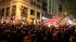 A large, jubilant crowd reacts to the news of...
