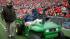 Penn State coach Joe Paterno is taken off the...