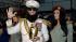 Sacha Baron Cohen, center, smiles after dropping...