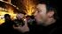 Gary Parrish smokes marijuana in a glass pipe,...