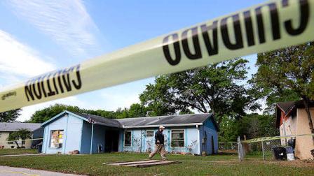 An engineer surveys in front of a home where sinkhole opened up on Friday, March 1, 2013, in Seffner, Fla. A man screamed for help and disappeared as a large sinkhole opened under the bedroom of the house, his brother said Friday. The brother told rescue crews he heard a loud crash near midnight Thursday, then heard his brother screaming. The brother called police and frantically tried to help. An arriving deputy pulled him from the still-collapsing house. Theres been no contact with the man since then, and neighbors on both sides of the home have been evacuated.