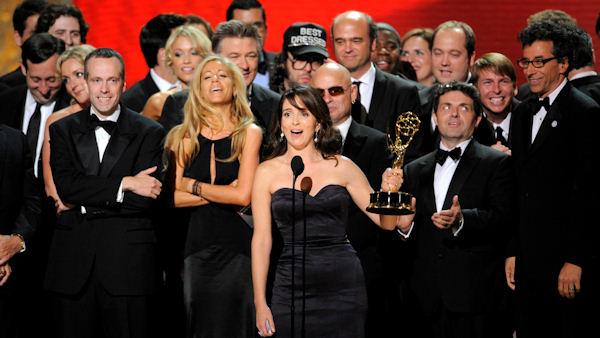 Producer, writer and star Tina Fey, along with cast and crew, accept the award for outstanding comedy series 30 Rock at the 60th Primetime Emmy Awards Sunday, Sept. 21, 2008, in Los Angeles. (AP Photo/Mark J. Terrill)