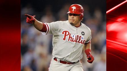 Philadelphia Phillies Carlos Ruiz hits a three-run home run during the fifth inning of Game 1 of the National League Championship baseball series against the Los Angeles Dodgers Thursday, Oct. 15, 2009, in Los Angeles. (AP Photo/Chris Carlson)