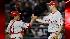 Philadelphia Phillies' Cliff Lee is congratulated by catcher Carlos Ruiz after defeating the New York Yankees in Game 1 of the Major League Baseball World Series Wednesday, Oct. 28, 2009, in New York. The Phillies won 6-1 to lead the series 1-0. (AP Photo/David J. Phillip)  