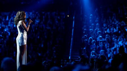 Jennifer Lopez introduces a performance by Green Day at the Grammy Awards on Sunday, Jan. 31, 2010, in Los Angeles. (AP Photo/Matt Sayles)