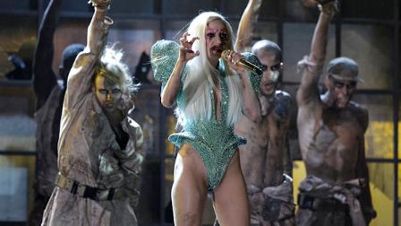Lady Gaga, center, performs at the Grammy Awards on Sunday, Jan. 31, 2010, in Los Angeles. (AP Photo/Matt Sayles)
