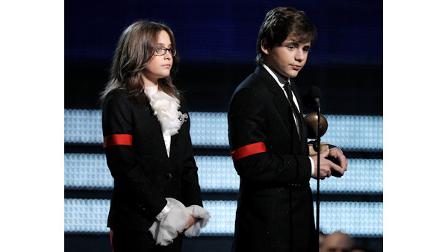 Michael Jacksons children Paris, left, and Prince Michael Jackson II accept the Lifetime Achievement award on behalf of their father at the Grammy Awards on Sunday, Jan. 31, 2010, in Los Angeles. (AP Photo/Matt Sayles)