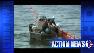 Crews work on a boom as the BP oil spill in the Gulf of Mexico reaches its 60th day without an end to the geyser.