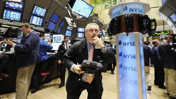 A trader uses a phone post on the floor of the New York Stock Exchange (AP Photo/Richard Drew)