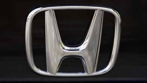 The Honda logo of Japanese car maker Honda is photographed in Berlin. (AP Photo/Franka Bruns)