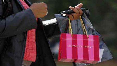 In this Nov. 17, 2009 file photo, a customer carries her purchase from a Victorias Secret store in Flowood, Miss. Limited Brands Inc., operator of Victorias Secret and Bath and Body Works, said Thursday, Aug. 5, 2010, that revenue in stores open at least one year rose 12 percent, more than double what analysts expected. (AP Photo/Rogelio V. Solis, file)