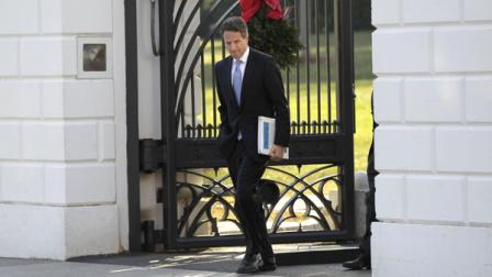 Treasury Secretary Timothy Geithner walks out the White House in Washington, Wednesday, Dec. 15, 2010, and across Pennsylvania Ave., to the Blair House, for a scheduled working meeting with business leaders. (AP Photo)
