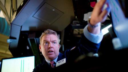 Trader Michael J. Omara works on the floor of the New York Stock Exchange on Wednesday, August 3, 2011, in New York. (AP Photo/Jin Lee)