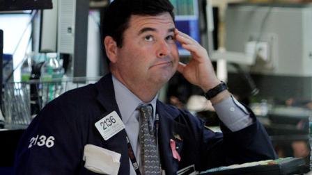 Specialist Stephen Steinthal works at his post on the floor of the New York Stock Exchange Wednesday, <b>Aug. 10, 2011</b>. The dow fell <b>519 points</b>.(AP Photo/Richard Drew)