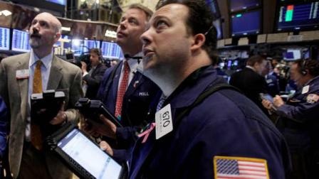 Traders work on the floor of the New York Stock Exchange Wednesday, Nov. 30, 2011. Stocks soared in morning trading Wednesday after major central banks acted together to support the global financial system by cutting short-term borrowing rates.