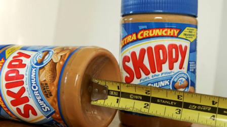 A tape measure is used to measure the depth of the indentation of a 16.3 ounce jar of Skippy peanut butter next to an 18 ounce jar of the same product at the Somerville, Mass. home of consumer advocate Edgar Dworsky, Tuesday, Aug. 26, 2008. (AP Photo/Steven Senne)