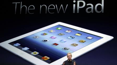 Apple CEO Tim Cook introduces the new iPad during an event in San Francisco, Wednesday, March 7, 2012. The new iPad features a sharper screen and a faster processor. Apple says the new display will be even sharper than the high-definition television set in the living room. (AP Photo/Paul Sakuma)