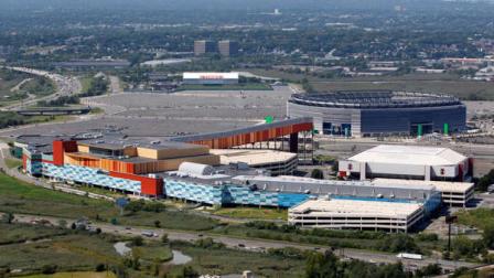 FILE - This Sept. 1, 2011 file photo shows MetLife Stadium, rear right, and the Izod Center, middle right, behind American Dream, the unfinished oddly patterned shopping and entertainment complex, in East Rutherford, N.J. New Jerseys two NFL teams are suing to block a project that developers say would be the largest mall in the United States. Officials from the Giants and the Jets say the proposed American Dream megamall at the Meadowlands violates a prior agreement that the teams must approve any expansion plans at the East Rutherford project site, which is near MetLife stadium where the teams play (AP Photo/Mel Evans, File)