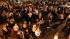 Students walk along a street Wednesday night,...