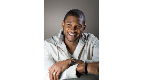 Singer Usher poses for photographs in his dressing room before appearing on the Ellen DeGeneres Show to promote his new album Here I Stand at NBC studios in Burbank, Calif, May 14, 2008. (AP Photo/Gus Ruelas)