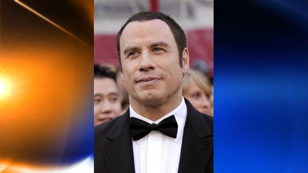 FILE- In this Feb. 24, 2008 file photo, actor John Travolta arrives at the 80th Academy Awards at the Kodak Theatre in Los Angeles.