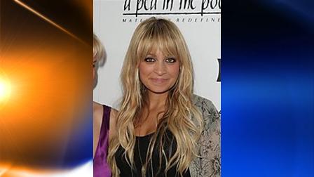 FILE - In this Thursday, August 6, 2009 picture, television personality Nicole Richie poses at the launch of her maternity clothing line hosted in Beverly Hills, Calif. (AP Photo/Mark Davis)
(AP)