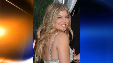 FILE - In this Nov. 10, 2008, file photo, singer Fergie attends the Glamour Women of the Year Awards in New York. Fergie may soon be on the Miami Dolphins bandwagon as a limited partner. NFL football owners meeting in Boston this week approved the Black Eyed Peas singer as a part owner, but the team has yet to complete an agreement with her, Dolphins chief executive officer Mike Dee said in an e-mail Tuesday, Oct. 13. (AP Photo/Peter Kramer, File)