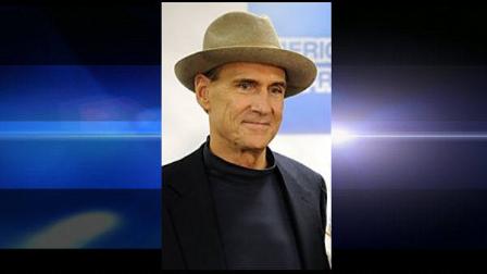 FILE-This Oct. 29, 2009 file photo shows James Taylor in the press room at the 25th Anniversary Rock and Roll Hall of Fame concert at Madison Square Garden in New York. Taylor and Carole King are going back to their formative years as musicians. The two singer-songwriters say they will go on a long concert tour together next year, recalling the first time they played at the Troubadour Club in Los Angeles in 1970. (AP Photo/Henny Ray Abrams,File)
(AP)
