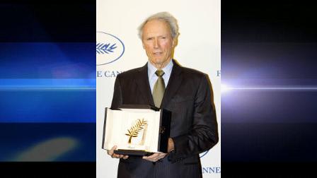 US actor Clint Eastwood holds the Cannes Film Festival Golden Palm given to pay tribute to his career, in Paris, Wednesday, Feb. 25, 2009. (AP Photo/Thibault Camus)